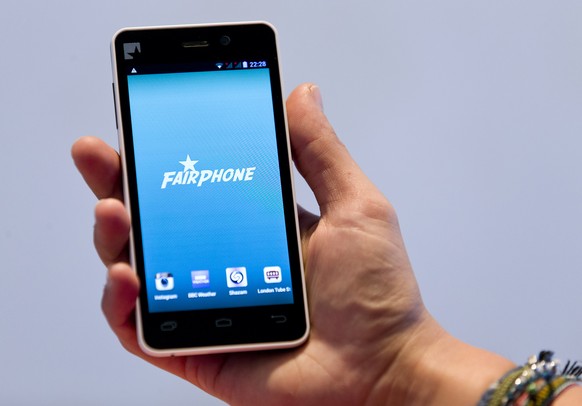 A picture shows a prototype of a Fairphone smartphone during its unveiling in London on September 18, 2013. A Dutch company introduced the Fairphone that promises similar performance to other widely p ...