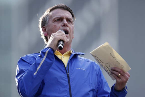 Former President Jair Bolsonaro speaks during a protest against his Supreme Court trial, in which he is accused of involvement in a 2022 coup attempt, in Sao Paulo, Sunday, June, 29, 2025. (AP Photo/E ...