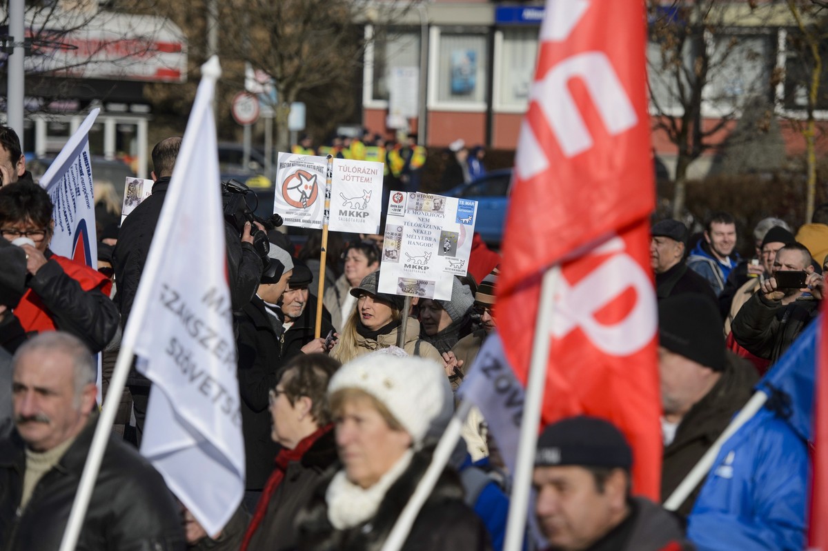epa07299996 People listen to a speech during a protest against the recent amendments to the labour code, dubbed 'slave law' by opposition forces, in Salgotarjan, Hungary, 19 January 2019. Si ...