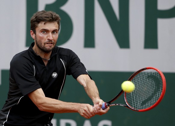 Gilles Simon of France plays a shot to Martin Klizan of Slovakia during their men&#039;s singles match at the French Open tennis tournament at the Roland Garros stadium in Paris, France, May 27, 2015. ...