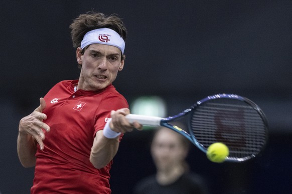 epa10447308 Switzerland's Marc-Andrea Huesler in action against Germany's Alexander Zverev during their Tennis Davis Cup qualifiers match for the 2023 group stage between Germany and Switzerland, at t ...