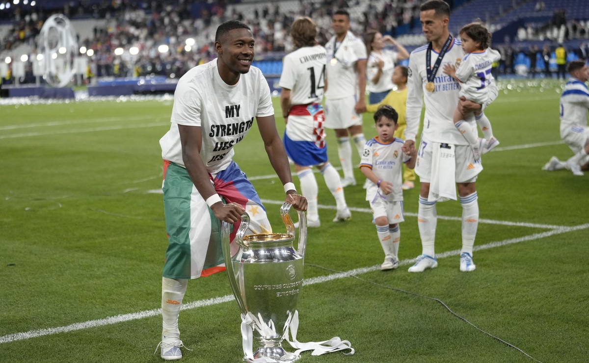 Real Madrid's David Alaba poses for a photograph with the trophy after winning the Champions League final soccer match between Liverpool and Real Madrid at the Stade de France in Saint Denis near ...