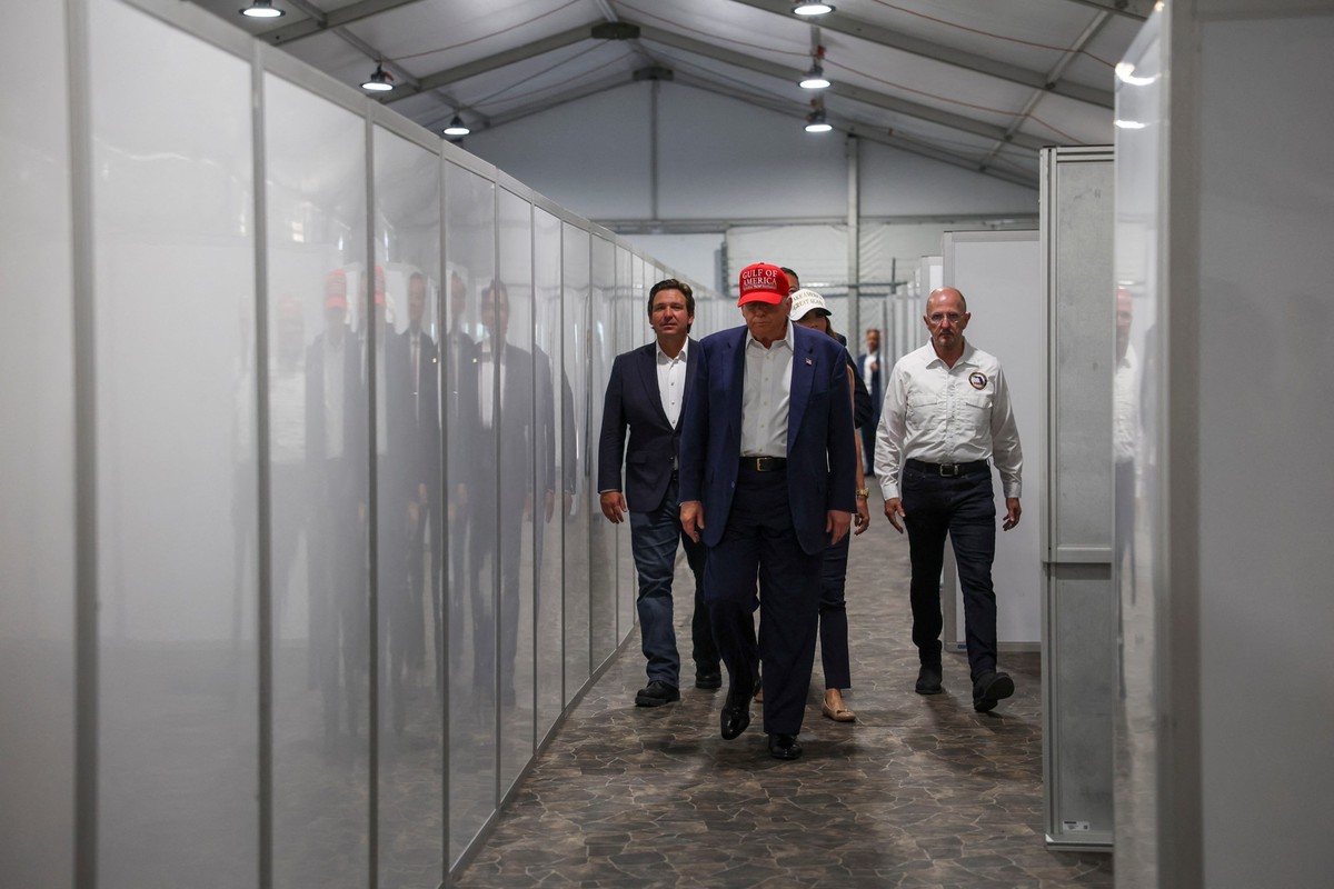 U.S. President Donald Trump, Florida Governor Ron DeSantis and U.S. Homeland Security Secretary Kristi Noem visit a temporary migrant detention center informally known as "Alligator Alcatraz&quot ...