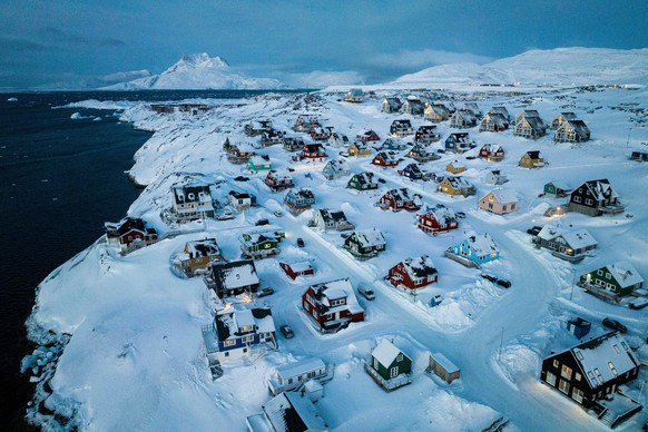 FILE - Houses covered in snow are seen on the coast of a sea inlet of Nuuk, Greenland, March 7, 2025. (AP Photo/Evgeniy Maloletka, File)
Greenland-Security-Explainer