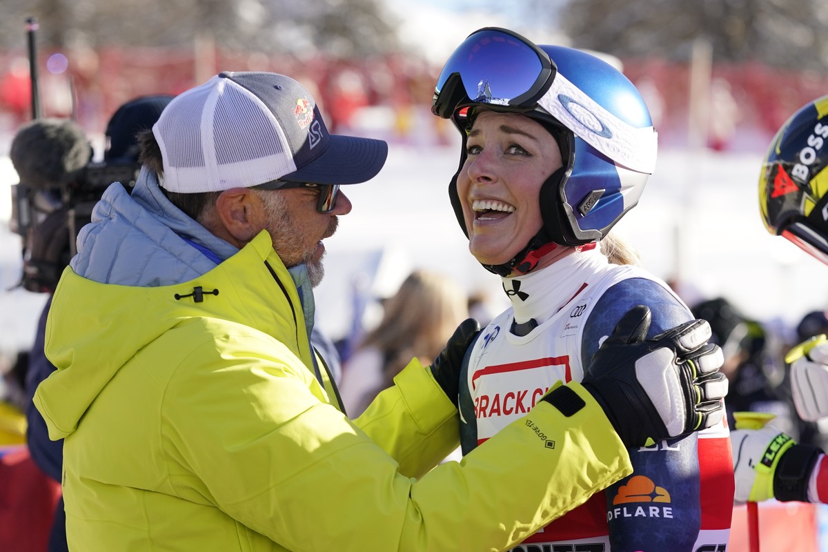 United States' Lindsey Vonn, right, is congratulated by Red Bull Head of Athletes Special Projects Patrick Riml after she competed in an alpine ski, women's World Cup super G, in St. Moritz, ...
