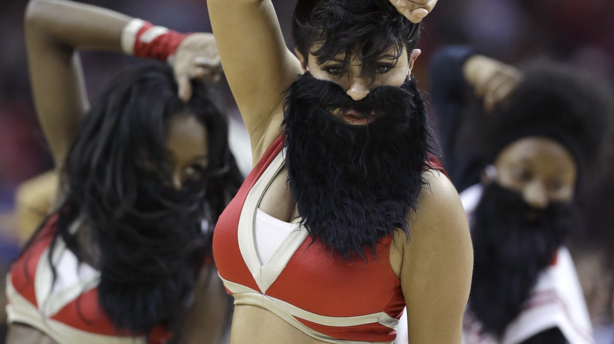 Houston Rockets Power Dancers and staff dance wearing beards mimicking Rockets' James Harden during a timeout in the first half of an NBA basketball game against the Cleveland Cavaliers, Sunday,  ...