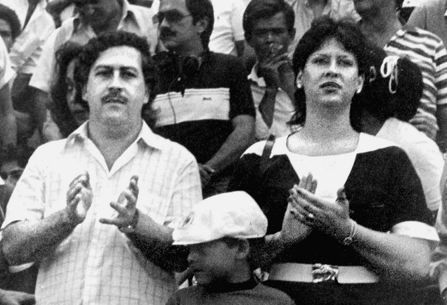 FILE--Pablo Escobar, left, boss of the Medellin drug cartel, is shown with his wife, Victoria Henau Vallejos, right, and son while attending a soccer match in Bogota, Colombia in this undated file pho ...