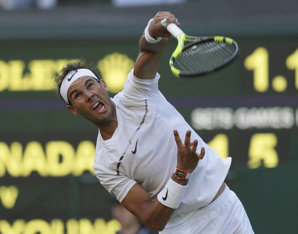 Spain&#039;s Rafael Nadal returns to Donald Young of the United States during their Men&#039;s Single Match on day three at the Wimbledon Tennis Championships in London Wednesday, July 5, 2017. (AP Ph ...