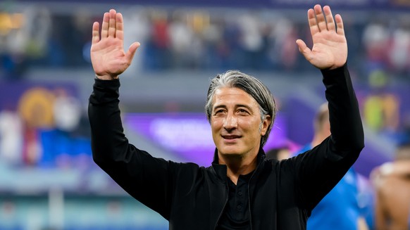 Switzerland's head coach Murat Yakin celebrates the victory and the qualification during the FIFA World Cup Qatar 2022 group G soccer match between Serbia and Switzerland at the Stadium 974, in D ...