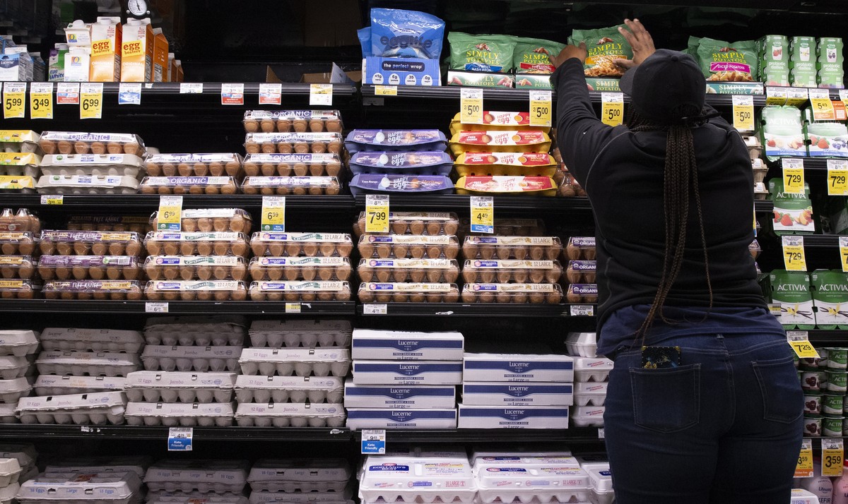 epa10270129 An employee stocks food items beside eggs at a Safeway supermarket, a subsidiary of Albertsons, in Washington, DC, USA, 27 October 2022. DC's Office of the Attorney General will inves ...