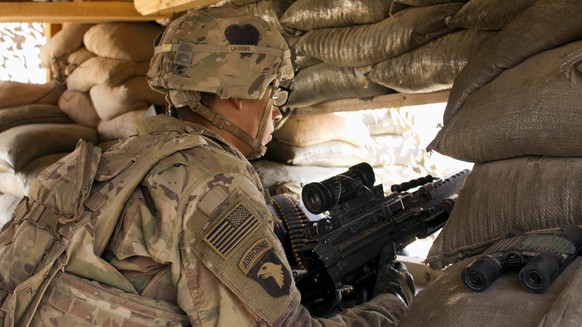 FILE - In this Sept. 8, 2016 file photo, a U.S. Army soldier guards a position at Camp Swift, northern Iraq. Iraq