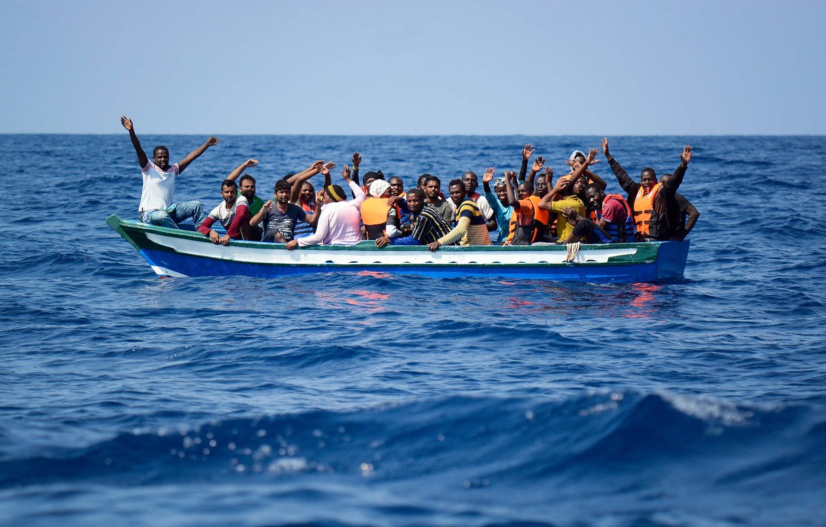 epa06947850 A handout photo made available by SOS Mediterranee on 13 August 2018 shows migrants being rescued by the NGO's rescue ship 'Aquarius' in the Mediterranean, 10 August 2018. T ...