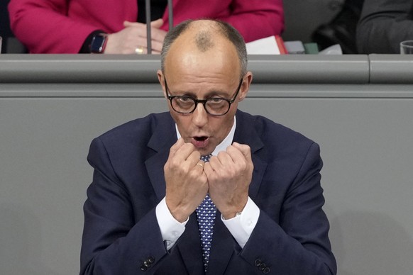 Opposition leader Friedrich Merz of CDU speaks during a plenary session at the German parliament Bundestag where he faces a vote of confidence, Berlin, Germany, Monday, Dec. 16, 2024. (AP Photo/Markus ...