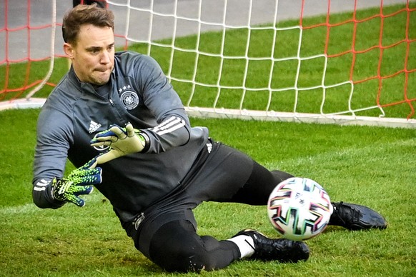 epa09107020 Germany's goalkeeper Manuel Neuer performs during his team's training session in Duesseldorf, Germany, 30 March 2021. Germany will face North Macedonia in their FIFA World Cup 20 ...
