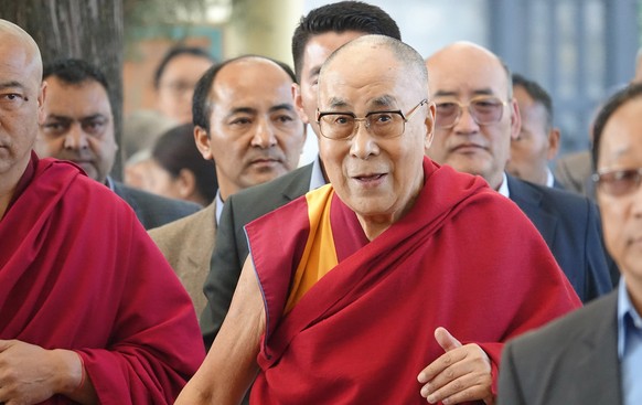 epa06597799 Tibetan leader, the Dalai Lama, arrives to speak at the Mind &amp; Life Dialogue “Reimagining Human Flourishing” at the main Buddhist temple, Tsuglagkhang in the north Indian hill town of  ...