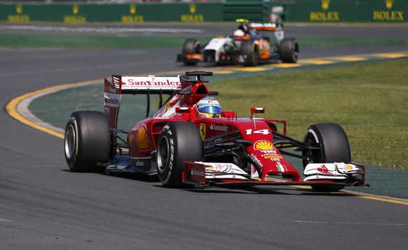 Ferrari Formula One driver Fernando Alonso of Spain (front) drives ahead of Force India Formula One driver Sergio Perez of Mexico during the first practice session of the Australian F1 Grand Prix at the Albert Park circuit in Melbourne March 14, 2014. REUTERS/David Gray (AUSTRALIA  - Tags: SPORT MOTORSPORT F1)  