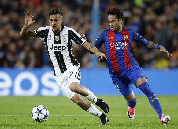 FILE - In this April 19, 2017 file photo, Barcelona&#039;s Neymar challenges Juventus&#039;s Paulo Dybala, left, during the Champions League quarterfinal second leg soccer match between Barcelona and  ...