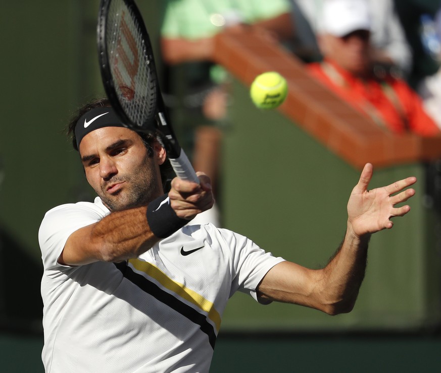 epa06604702 Roger Federer of Switzerland in action against Jeremy Chardy of France during the BNP Paribas Open at the Indian Wells Tennis Garden in Indian Wells, California, USA, 14 March 2018. EPA/JO ...