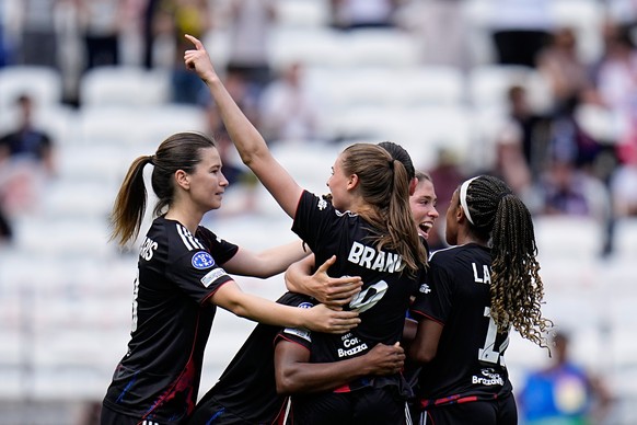 Lyonnes' Jule Brand celebrates after scoring her side's third goal during the Women's Champions League semifinal, second leg, soccer match between OL Lyonnes and Arsenal, in Decines, ou ...