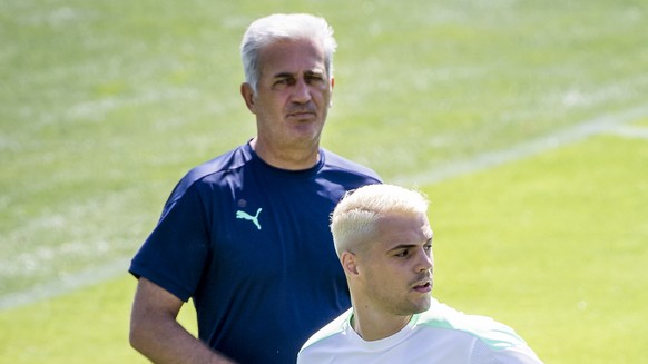 Switzerland&#039;s head coach Vladimir Petkovic, left, and Switzerland&#039;s midfielder Granit Xhaka, right, react during a training session for the Euro 2020 soccer tournament at the Tre Fontane spo ...