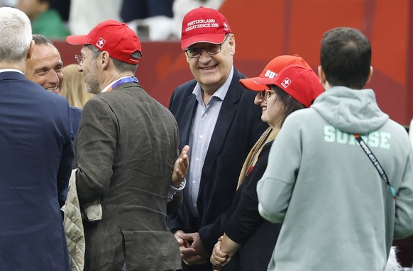 Swiss Federal President Guy Parmelin wears a hat with the writing "Switzerland Great since 1291" prior to the World Cup round of 32 soccer match between Switzerland and Algeria at the BC Pla ...