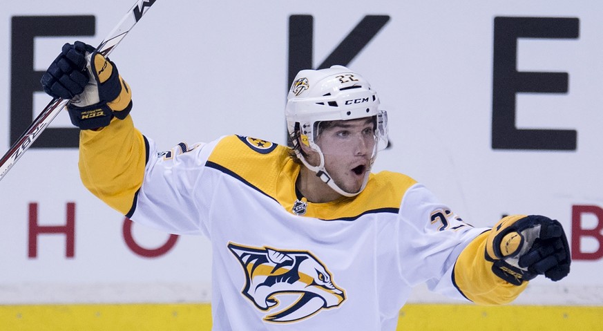 Nashville Predators left wing Kevin Fiala (22) celebrates his goal during third period of an NHL hockey game against the Vancouver Canucks, in Vancouver on Wednesday, Dec. 13, 2017. (Jonathan Hayward/ ...