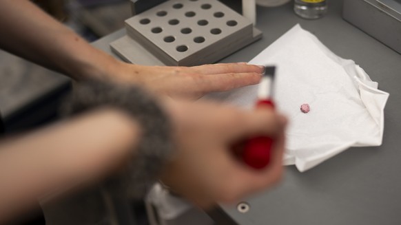 An MDMA pill called "Jacky die Moerderpuppe" is tested in the Saferparty Lab during the 32th Street Parade in the city center of Zurich, Switzerland, Saturday, August 9, 2025. The annual dan ...