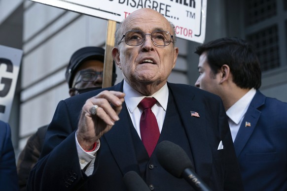 FILE - Former Mayor of New York Rudy Giuliani speaks during a news conference outside the federal courthouse in Washington, Friday, Dec. 15, 2023. A jury awarded $148 million in damages on Friday to t ...