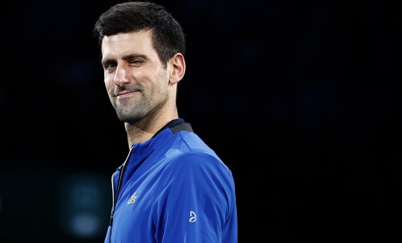 epa07969791 Novak Djokovic of Serbia celebrates with the trophy after winning the final match against Denis Shapovalov of Canada at the Rolex Paris Masters tennis tournament in Paris, France, 03 Novem ...