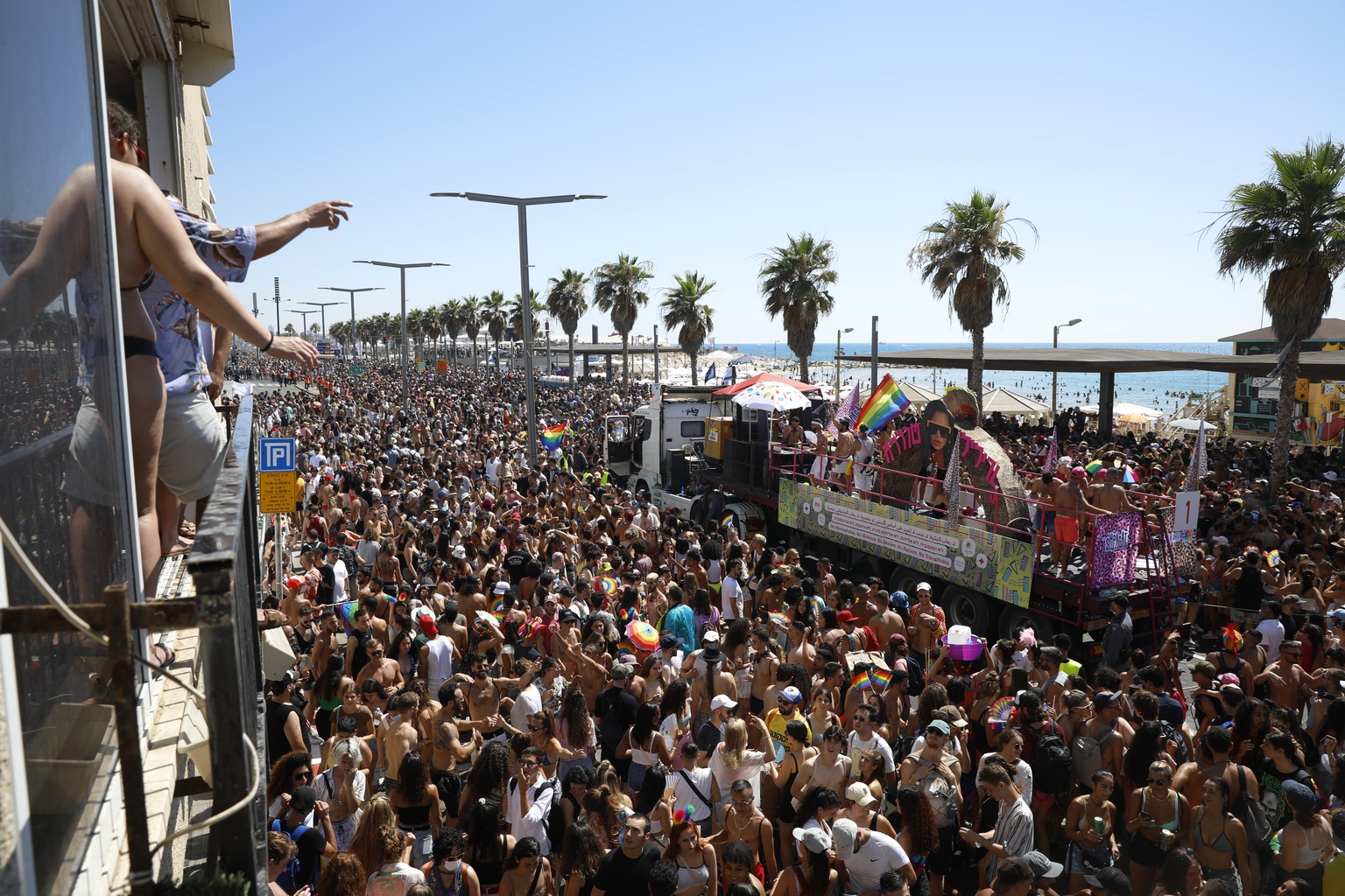 People take part in the annual Pride Parade, in Tel Aviv, Israel, Friday, June 25, 2021. Tens of thousands of people attended the parade on Friday in one of the largest public gatherings held in Israe ...