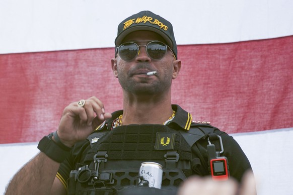 FILE - In this Sept. 26, 2020, file photo, Proud Boys leader Henry &quot;Enrique&quot; Tarrio wears a hat that says The War Boys during a rally in Portland, Ore. Tarrio, has been sentenced to five mon ...