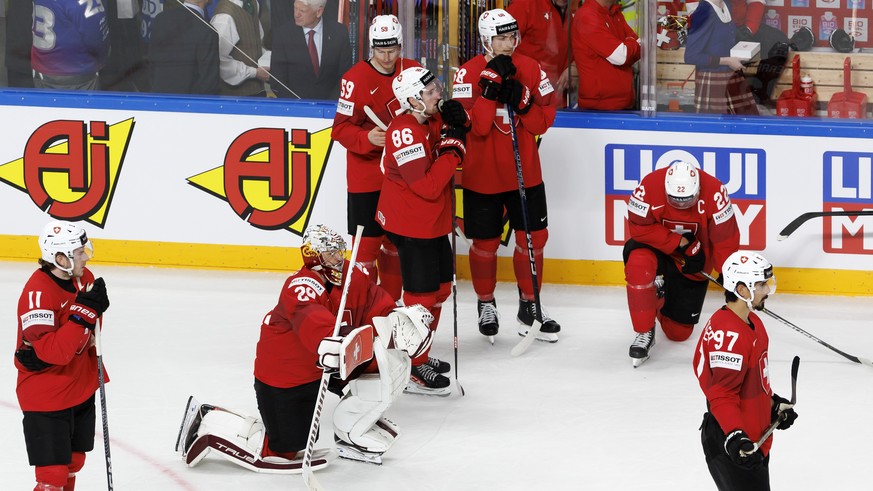 Switzerland&#039;s players look disappointed after losing against the team Germany, during the IIHF 2023 World Championship quarter final game between Switzerland and Germany, at the Riga Arena, in Ri ...