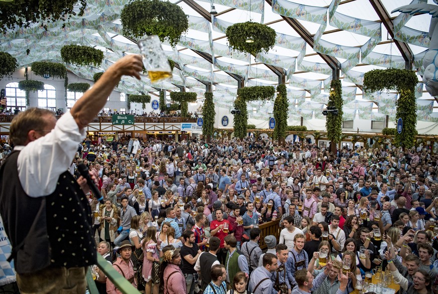 epa09175937 (FILE) - Visitors cheer inside the Hofbraeu tent during the opening of the 184th edition of the traditional Oktoberfest beer and amusement festival in the German Bavaria state&#039;s capit ...