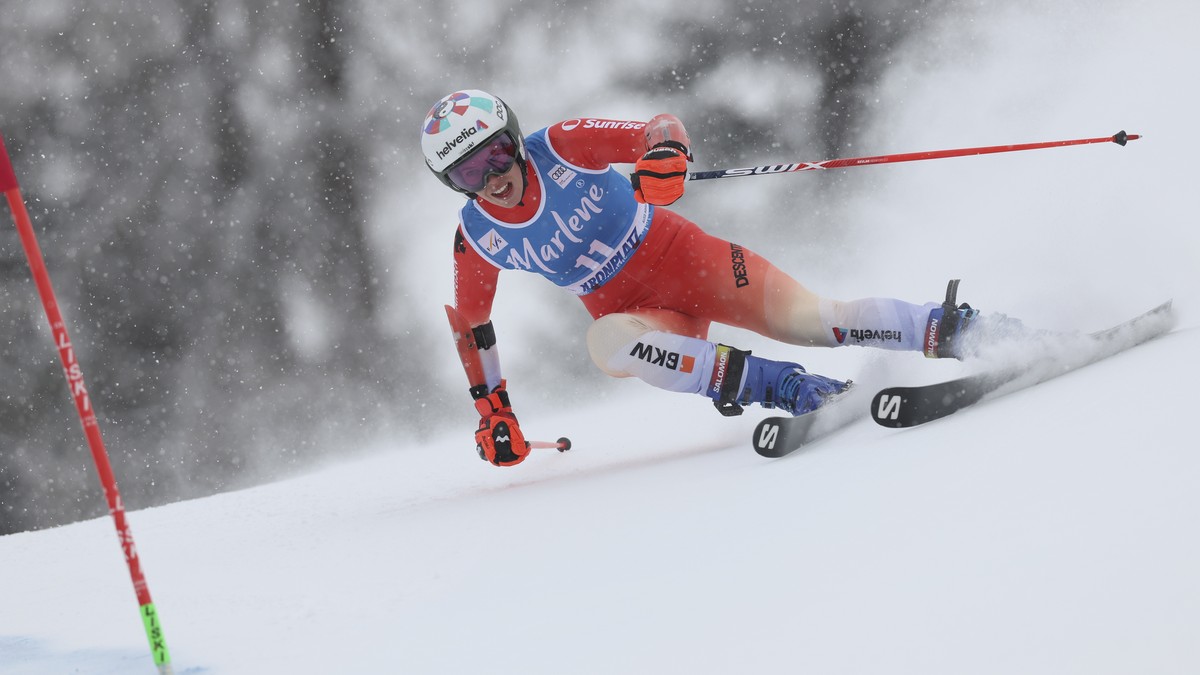 Switzerland's Michelle Gisin speeds down the course during an alpine ski, women's World Cup giant slalom, in Kronplatz, Italy, Tuesday, Jan. 24, 2023. (AP Photo/Alessandro Trovati)