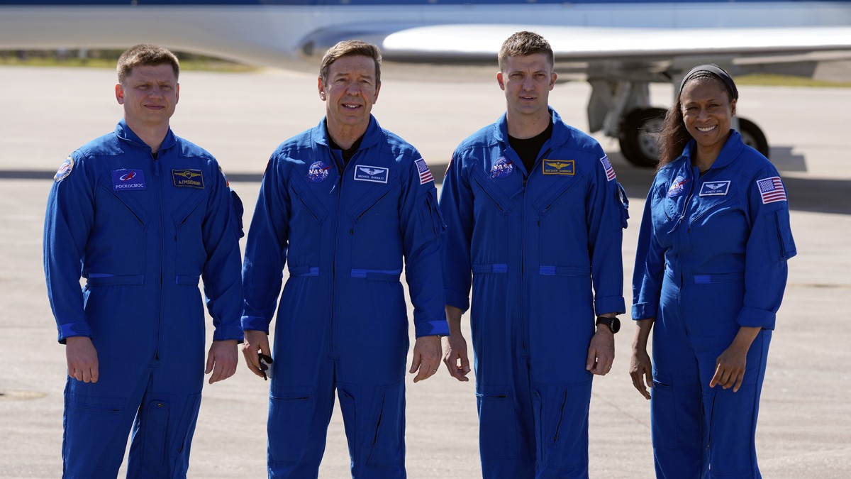 The SpaceX crew of the Dragon spacecraft, from left, cosmonaut Alexander Grebenkin, pilot Michael Barratt, commander Matthew Dominick and mission specialist Jeanette Epps gather for a photo after arri ...