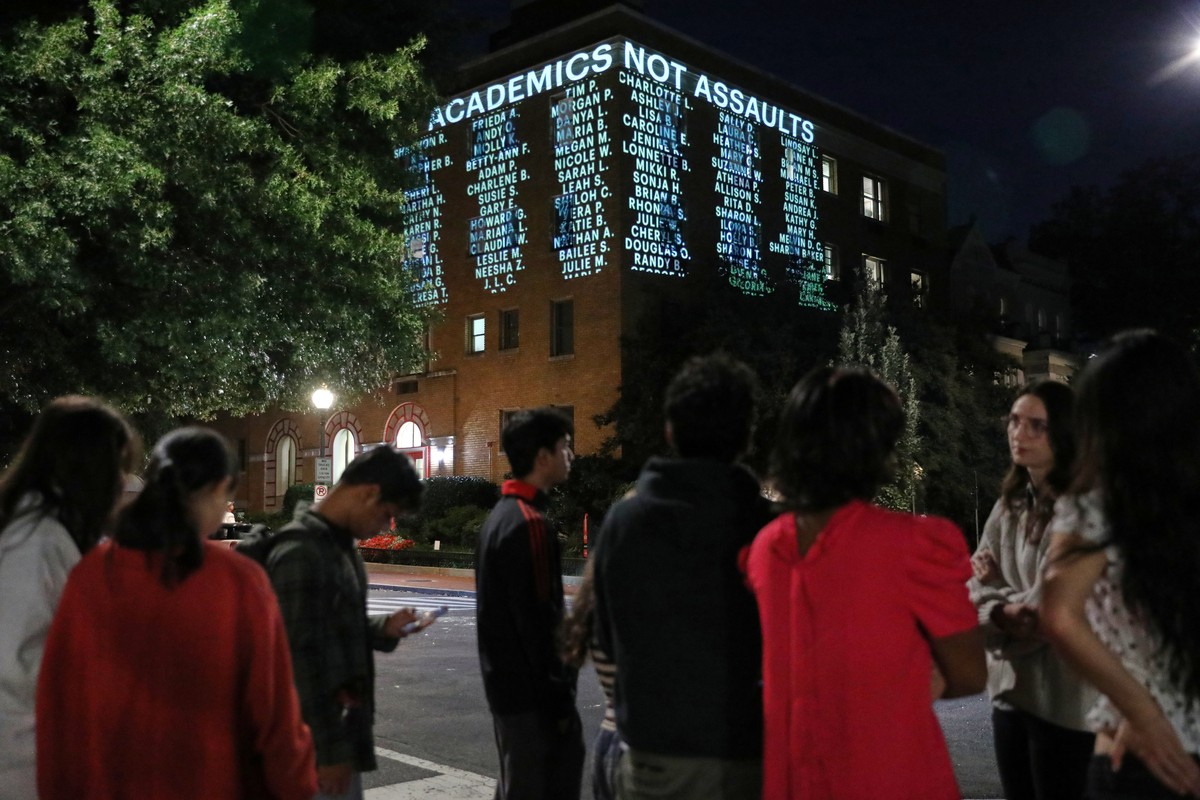 People watch as a message is projected on the side of a Cornell University building, Wednesday, Oct. 7, 2026, in Washington. (AP Photo/Rahmat Gul)
Cornell Investigation