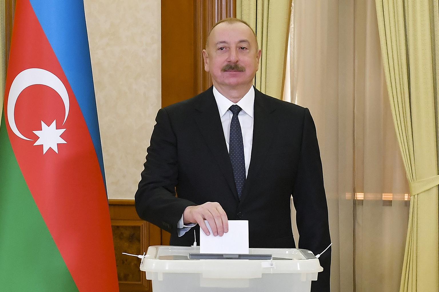 Azerbaijan President Ilham Aliyev casts his ballot during presidential election at a polling station in Khankendi, Karabakh region, Azerbaijan, Wednesday, Feb. 7, 2024. Azerbaijanis are voting Wednesd ...