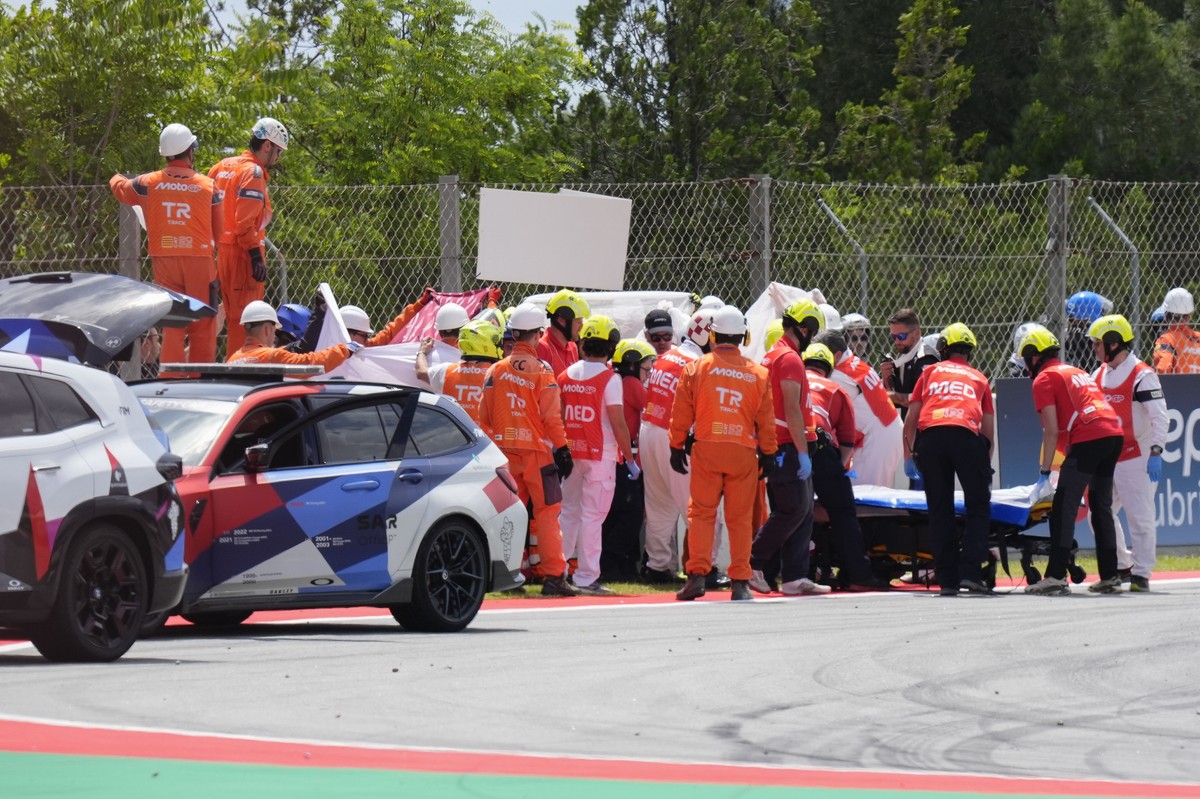 epa12967545 Spanish MotoGP rider Alex Marquez is assisted by paramedics after crashing during the Moto GP race of the Grand Prix of Catalonia at the Circuit de Barcelona-Catalunya racetrack in Montmel ...