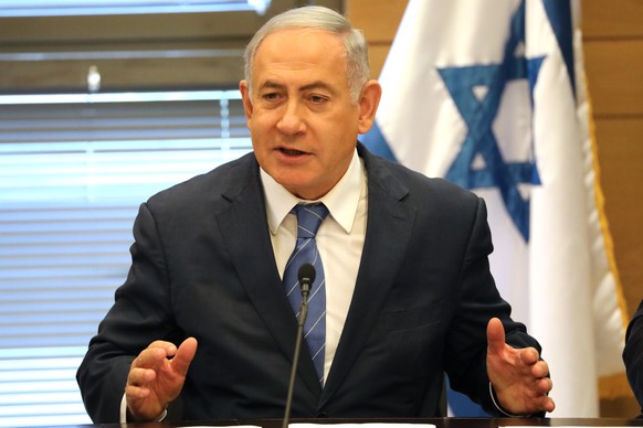 epa07863665 Acting Israeli Prime Minister and leader of the Likud party Benjamin Netanyahu (C) attends his party faction meeting at the Knesset in Jerusalem, Israel, 23 September 2019. The Israel poli ...