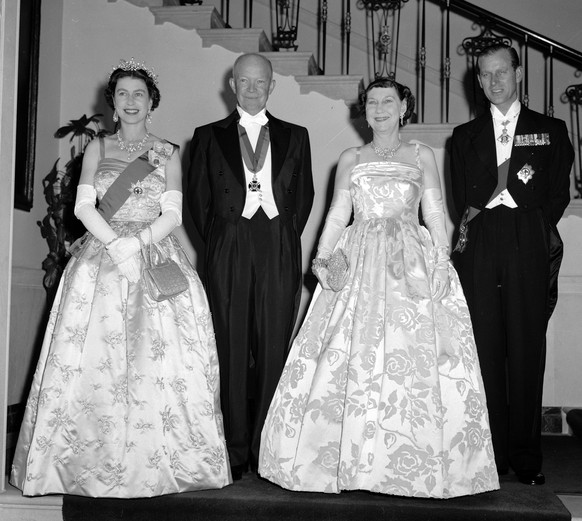 FILE - In this file photo dated Oct. 17, 1957, President Dwight Eisenhower, second left and first lady Mamie, second right are flanked by their royal guests, Britain's Queen Elizabeth II and her ...