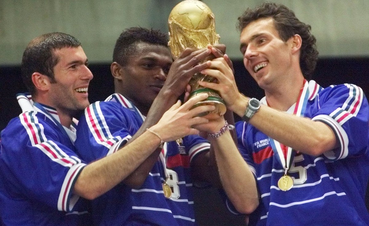 French teammates from left : Zinedine Zidane, Marcel Desailly and Laurent Blanc hold the World Cup after France defeated Brazil 3-0 in the final of the World Cup 98at the Stade de France in Saint Deni ...