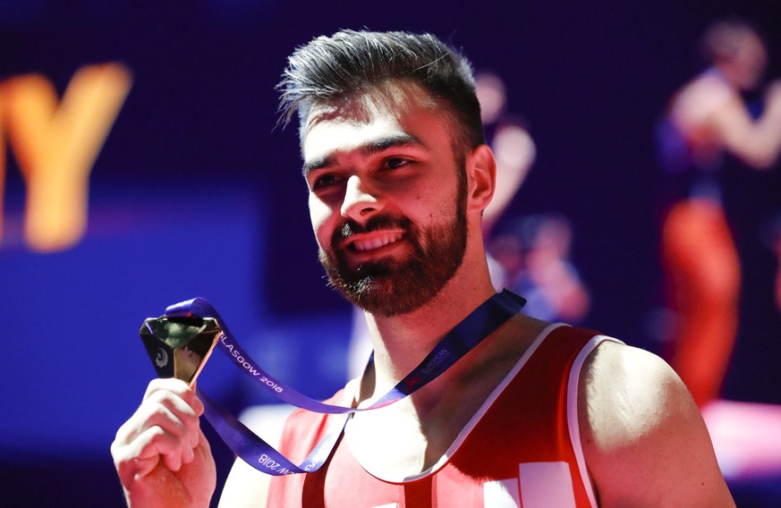 Oliver Hegi of Switzerland celebrates after winning the gold medal on the horizontal bar during the men&#039;s artistic gymnastics finals at the European Championships in Glasgow, Scotland, Sunday, Au ...