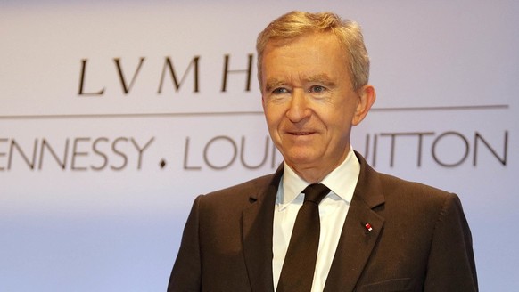 Bernard Arnault, Chairman and CEO of LVMH, Moet Hennessy Louis Vuitton, the Paris-based luxury goods empire, poses during the presentation of the 2012 year results, in Paris, Thursday, Jan. 31, 2013 . ...