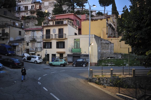 October 26, 2020, Catanzaro, Calabria, Italy: A lady seen walking in an empty street close to the city centre. .From Monday 26th October, according to a new decision of the Italian government, eaterie ...