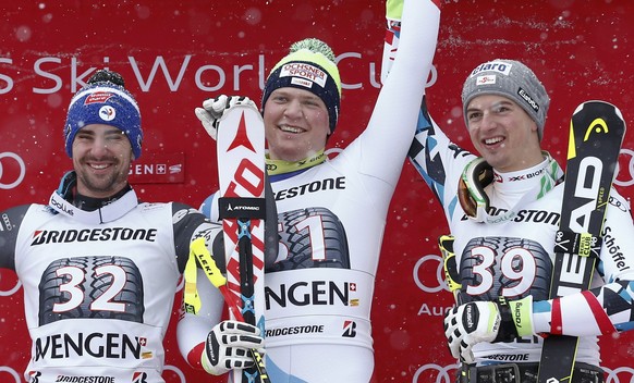 Alpine Skiing - FIS Alpine Skiing World Cup - Men&#039;s Super Combined - Wengen, Switzerland - 13/01/17 - Niels Hintermann of Switzerlands is flanked by Maxence Muzaton (L) of France and Austria&#039 ...