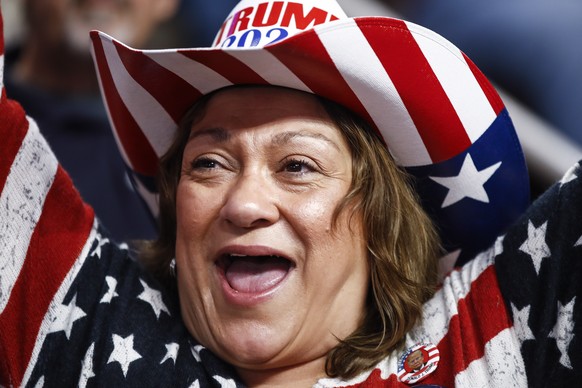 An attendee cheers ahead of a President Donald Trump campaign rally in Hershey, Pa., Tuesday, Dec. 10, 2019. (AP Photo/Matt Rourke)