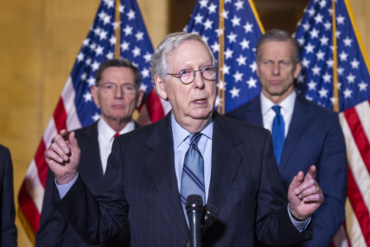 epa09695595 Republican Senate Minority Leader Mitch McConnell (C) speaks to the media about the upcoming Senate vote on the voting rights bill in the Russell Senate Office Building in Washington, DC,  ...