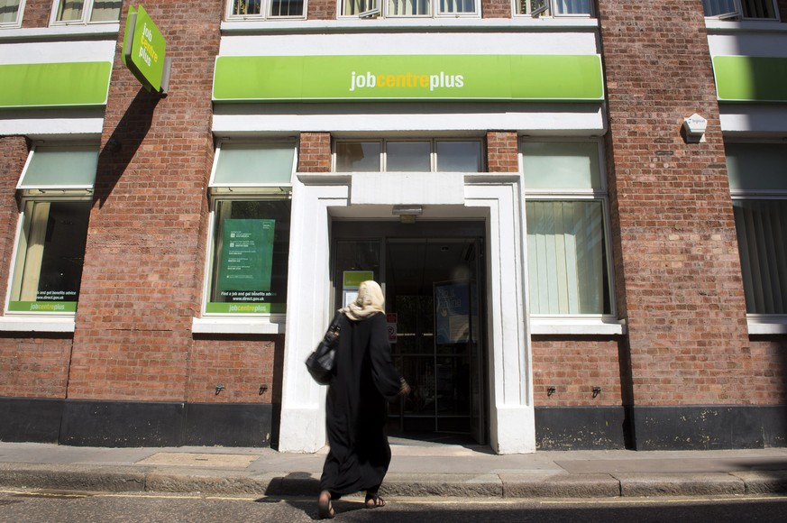 epa04746597 A woman walks to the entrance to a job centre in London, Britain, 13 May 2015. UK unemployment has continued to fall with the National Statistics saying that between January and March 2015 ...