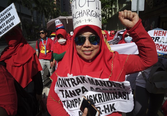 Migrants workers march during a rally to mark May Day in Hong Kong Tuesday, May 1, 2018. Thousands of Hong Kong workers from various labor unions staged a rally to demand better workers&#039; rights a ...