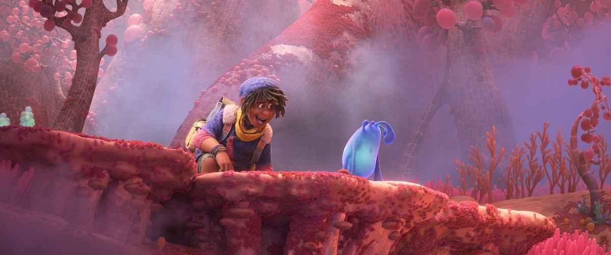 This image released by Disney shows Ethan, voiced by Jaboukie Young-White, left, with Splat, in a scene from the animated film "Strange World." (Disney via AP)